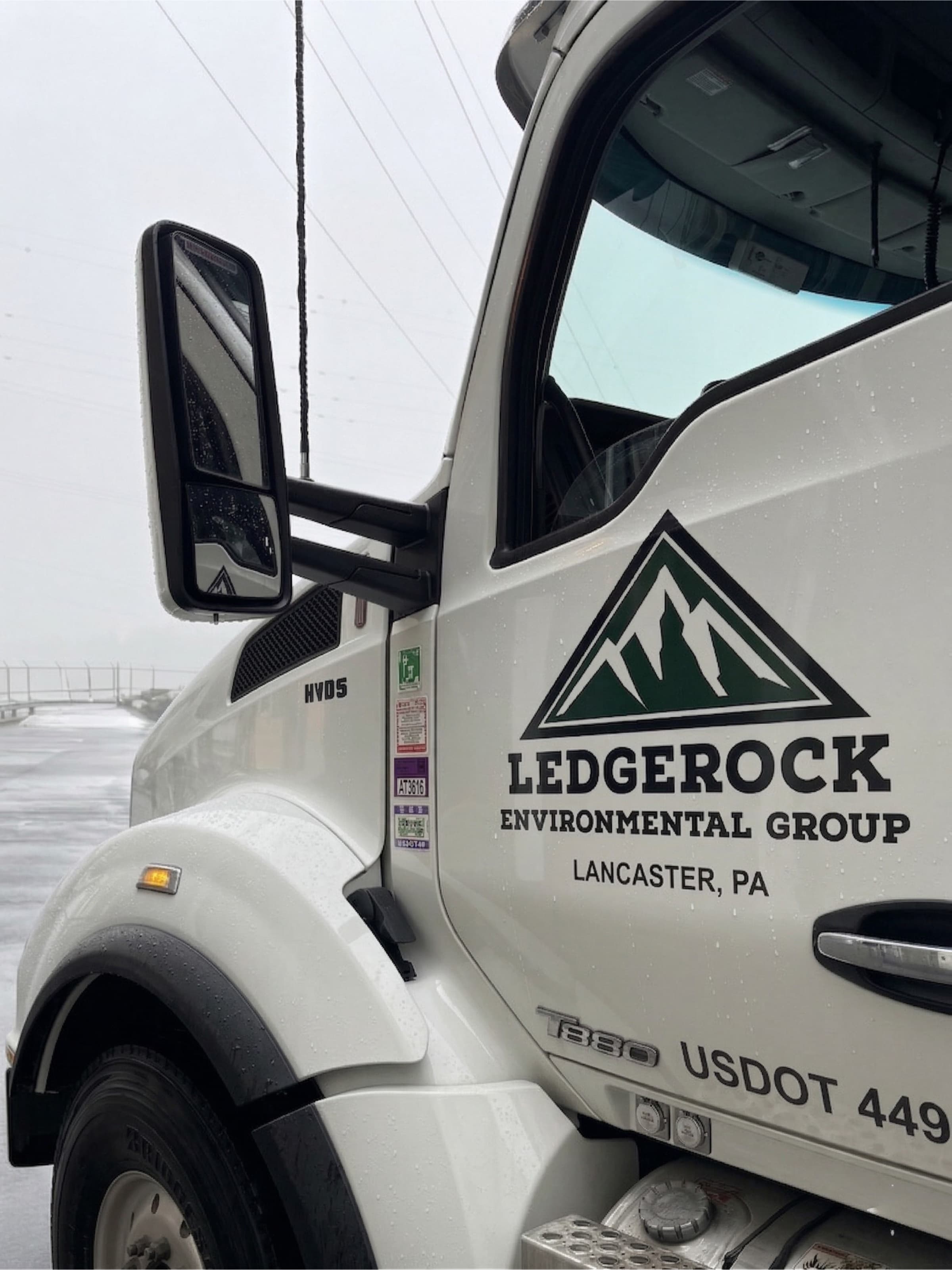 Ledgerock Environmental Group trucks at industrial facility